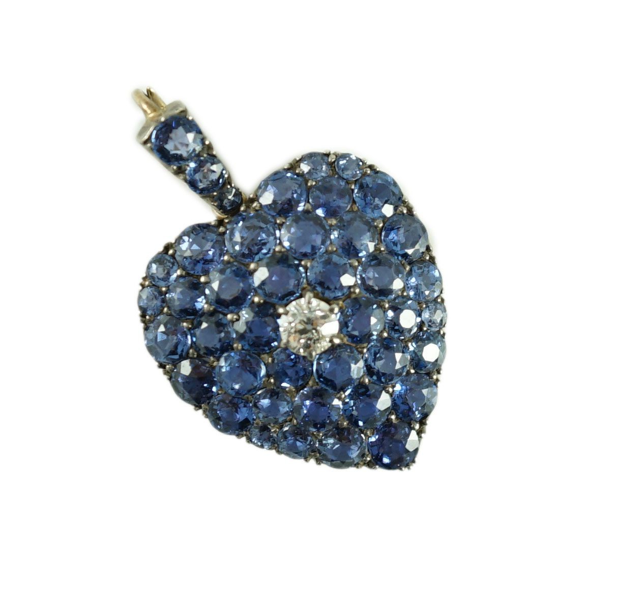 A late 19th/early 20th century gold and silver, sapphire and diamond heart shaped cluster pendant